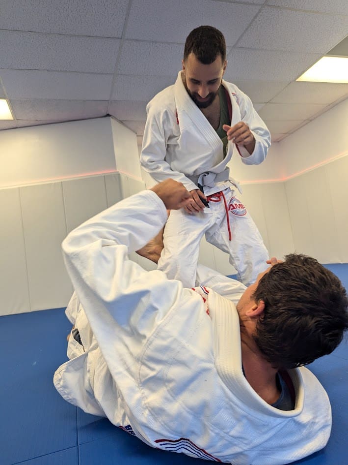Adults training together on the AMP mats