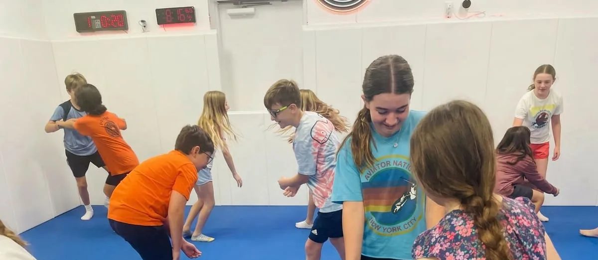 Kids playing games at an AMP summer camp