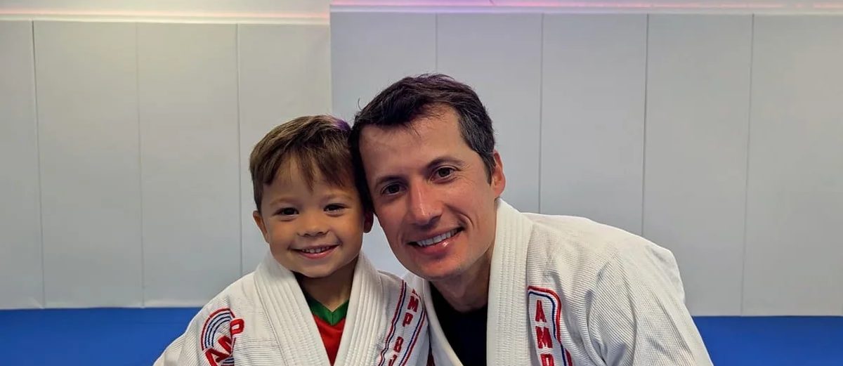 A father and son at AMP after a free trial class